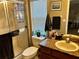 Bathroom featuring granite countertop and a shower with a glass door at 734 La Costa St, Minneola, FL 34715