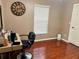 Bedroom with hardwood floors, lots of natural light, and a vanity area at 734 La Costa St, Minneola, FL 34715