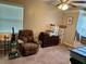 Bedroom with an armchair and boxes for storage at 734 La Costa St, Minneola, FL 34715
