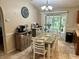 Bright and airy kitchen with tile flooring, a breakfast nook, and sliding glass doors at 734 La Costa St, Minneola, FL 34715