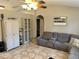 Comfortable living area featuring tile floors, modern furniture, and ample storage at 734 La Costa St, Minneola, FL 34715