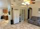 Open-concept living space with kitchen access and neutral decor at 734 La Costa St, Minneola, FL 34715