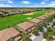 Golf course homes boast tile roofs and lush landscaping, perfect for enjoying the Florida sunshine at 8970 Azalea Sands Ln # 2302, Davenport, FL 33896