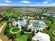 The aerial highlights community pools, volleyball court, clubhouse, and landscaped grounds at 8970 Azalea Sands Ln # 2302, Davenport, FL 33896