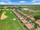 Upscale community of tile roofed homes next to a lush green golf course and athletic fields at 8970 Azalea Sands Ln # 2302, Davenport, FL 33896