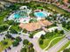 A high angle captures a resort-style pool, clubhouse, and lush landscaping at 8970 Azalea Sands Ln # 2302, Davenport, FL 33896