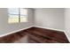 Bedroom featuring neutral paint, hardwood floors and a window at 8970 Azalea Sands Ln # 2302, Davenport, FL 33896