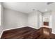 Bedroom featuring hardwood floors, neutral paint, and an ensuite bath at 8970 Azalea Sands Ln # 2302, Davenport, FL 33896