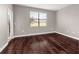 Bedroom with hardwood floors, neutral paint, and access to the outdoors at 8970 Azalea Sands Ln # 2302, Davenport, FL 33896