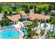 High angle of the clubhouse featuring a pool, fountain, and outdoor seating at 8970 Azalea Sands Ln # 2302, Davenport, FL 33896