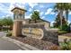 The Champions Club features a stone entrance, well-maintained landscaping, and a welcoming aesthetic at 8970 Azalea Sands Ln # 2302, Davenport, FL 33896