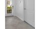 Clean and bright entryway with tile flooring and a sidelight window at 8970 Azalea Sands Ln # 2302, Davenport, FL 33896