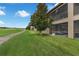 Rear exterior view featuring a screened lanai and golf course at 8970 Azalea Sands Ln # 2302, Davenport, FL 33896