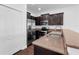 Well-equipped kitchen with stainless steel appliances, dark wood cabinets, and granite countertops at 8970 Azalea Sands Ln # 2302, Davenport, FL 33896