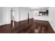 Spacious living room featuring hardwood floors and an open layout to the kitchen at 8970 Azalea Sands Ln # 2302, Davenport, FL 33896