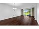 Bright living room featuring hardwood floors and sliding glass doors to the outside at 8970 Azalea Sands Ln # 2302, Davenport, FL 33896