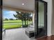 Relaxing screened porch with comfortable seating and a view of the golf course at 8970 Azalea Sands Ln # 2302, Davenport, FL 33896