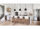 Elegant kitchen featuring a large center island, stainless steel appliances, and modern lighting at 917 Lake Emerald Dr, Orlando, FL 32806