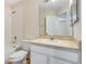 Bright bathroom with a tub and shower, neutral wall color, and a vanity sink at 12449 Cruxbury Dr, Windermere, FL 34786