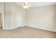 Spacious bedroom features neutral walls, plush carpeting and white doors at 12449 Cruxbury Dr, Windermere, FL 34786
