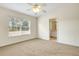 Bedroom with adjoining bathroom features neutral carpet and paint at 12449 Cruxbury Dr, Windermere, FL 34786