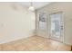 Bright breakfast nook area featuring tile floors, a window, and a door at 12449 Cruxbury Dr, Windermere, FL 34786