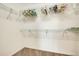 Walk-in closet features wall-mounted shelving for clothing storage at 12449 Cruxbury Dr, Windermere, FL 34786