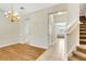 Bright dining area features new flooring and a decorative chandelier at 12449 Cruxbury Dr, Windermere, FL 34786