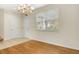 Dining room features new flooring, natural light and an elegant chandelier at 12449 Cruxbury Dr, Windermere, FL 34786