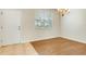 Well-lit dining area showcasing new flooring and natural light from the window at 12449 Cruxbury Dr, Windermere, FL 34786