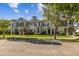 A view of a group of townhomes, featuring landscaping and a well-maintained exterior at 12449 Cruxbury Dr, Windermere, FL 34786