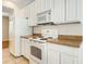 Kitchen with white appliances and cabinets provides a clean and functional space at 12449 Cruxbury Dr, Windermere, FL 34786