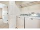 Bright laundry room with side-by-side washer and dryer for easy chore days at 12449 Cruxbury Dr, Windermere, FL 34786