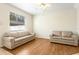 Cozy living room features wood flooring, ceiling fan, and natural light at 12449 Cruxbury Dr, Windermere, FL 34786