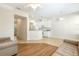 Bright living area featuring open access to the kitchen and neutral color palettes at 12449 Cruxbury Dr, Windermere, FL 34786