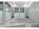 Close up of tub and shower with nice tile work and windows looking to the outside at 14202 Nell Dr, Orlando, FL 32832