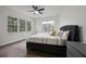Bright bedroom with large windows, hardwood floors, ceiling fan, and stylish furniture at 14202 Nell Dr, Orlando, FL 32832