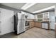 Efficient kitchen with stainless steel appliances, neutral countertops, and bright white cabinets offering ample storage at 14202 Nell Dr, Orlando, FL 32832