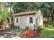 Charming shed with neutral siding, a double door, and plants outside at 14202 Nell Dr, Orlando, FL 32832