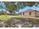 Spacious backyard featuring green grass and a wooden privacy fence at 144 Fort Smith Blvd, Deltona, FL 32738