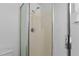 Shower with glass door, chrome fixtures, and white tiled wall at 144 Fort Smith Blvd, Deltona, FL 32738