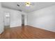 Bright bedroom with laminate floors, a ceiling fan, and a walk-in closet at 144 Fort Smith Blvd, Deltona, FL 32738