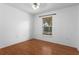 Light-filled bedroom with laminate floors and window view at 144 Fort Smith Blvd, Deltona, FL 32738