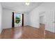 Bedroom with hardwood floors and a window with brown curtains at 144 Fort Smith Blvd, Deltona, FL 32738