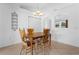 Dining area with tile floors, a wooden dining set, and a view to the outside at 144 Fort Smith Blvd, Deltona, FL 32738