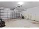 Spacious two-car garage with some stored items at 144 Fort Smith Blvd, Deltona, FL 32738