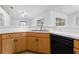 Kitchen area featuring wood cabinets and stainless steel appliances at 144 Fort Smith Blvd, Deltona, FL 32738