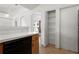 Bright kitchen featuring neutral countertops and wood cabinets, plus a storage closet with shelving at 144 Fort Smith Blvd, Deltona, FL 32738