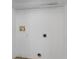 Laundry room with white walls, tile floors and fixtures at 144 Fort Smith Blvd, Deltona, FL 32738