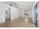 Open living area featuring tile flooring, light-colored walls, and an archway at 144 Fort Smith Blvd, Deltona, FL 32738